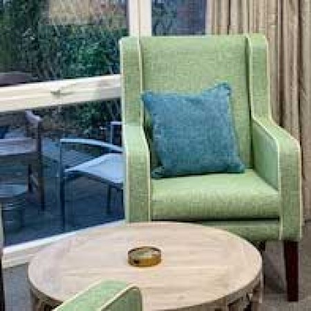 Arran High Back Generous Contract chair for in care home setting in green fabric with piping