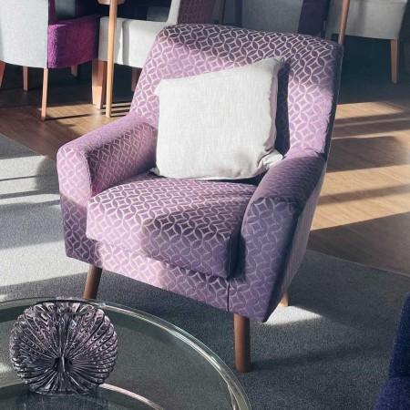 Lundy compact contract lounge chair ideal for clubs, hotels or care homes - in purple fabric