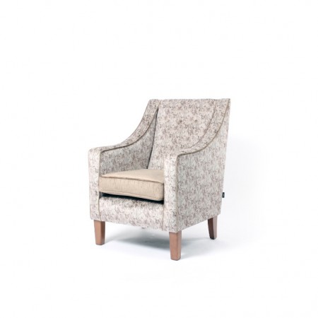 Rathlin comfortable high back contract lounge chair with raked back in floral fabric with contrasting seat and piping